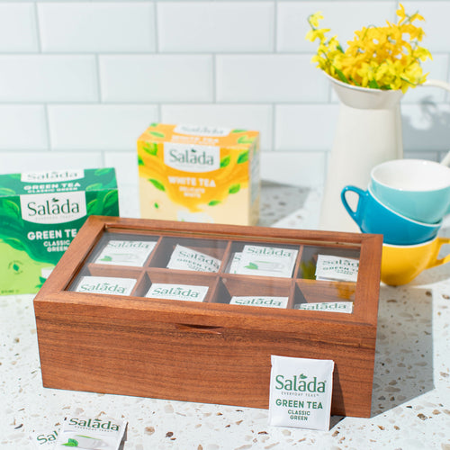 Salada tea chest, filled with Salada tea on a counter